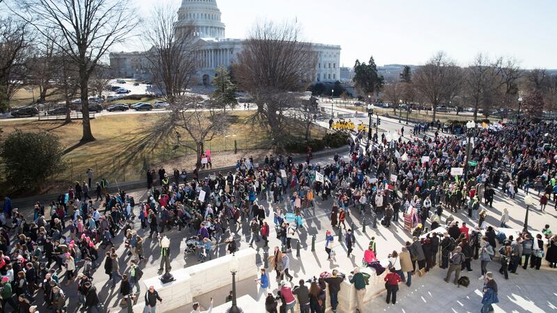 People walk on Constitution Avenue headed toward the supreme court, with the US Capitol seen behind, while participating in the 45th March for Life in Washington, DC. Photograph: Michael Reynolds/EPA
