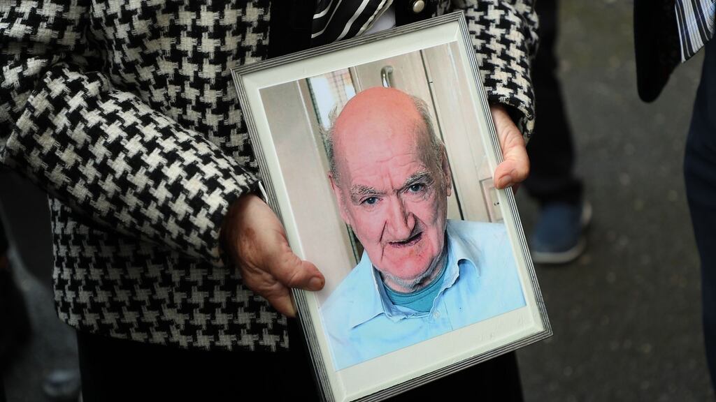 Margaret de Brun holds a photograph of Joseph Tuohy, who died alone in London. Photograph Nick Bradshaw for The Irish Times