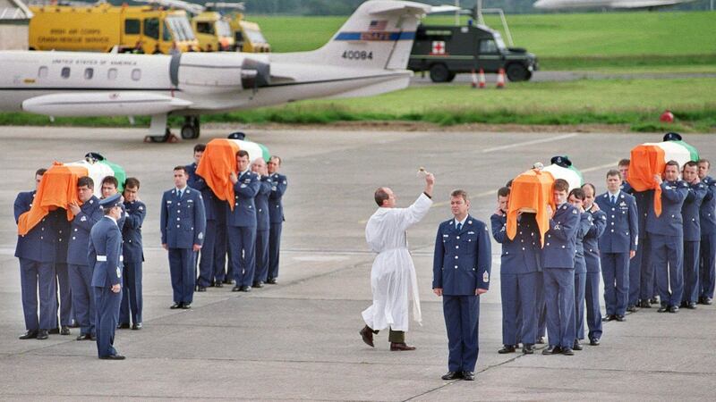 The remains of the four airmen are blessed on their arrival at Casement Aerodrome, Baldonnel, on July 3rd, 1999. Photograph: Joe St Leger