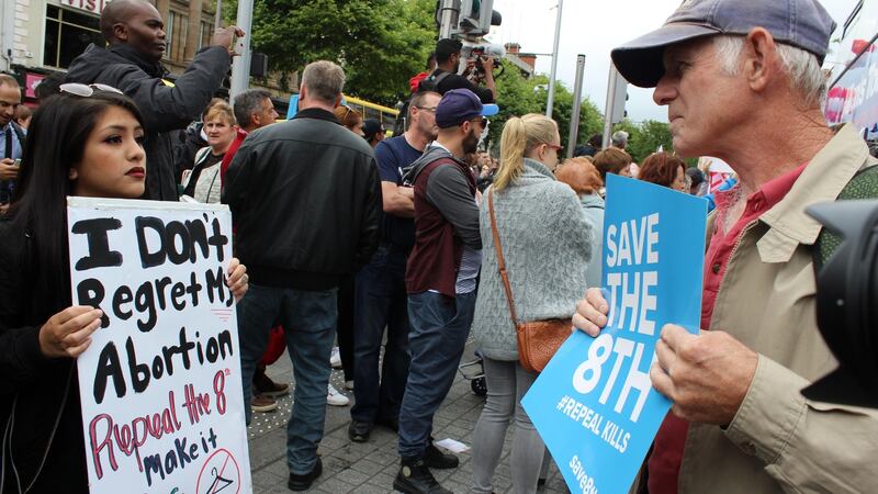 Pro-choice demonstrator Tawnie Ocampo (22) with an anti-abortion protester in Dublin. Photograph: Jack Power