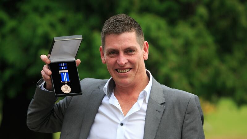 Martin Cullinane with his   bronze medal presented for bravery. Photograph: Gareth Chaney Collins
