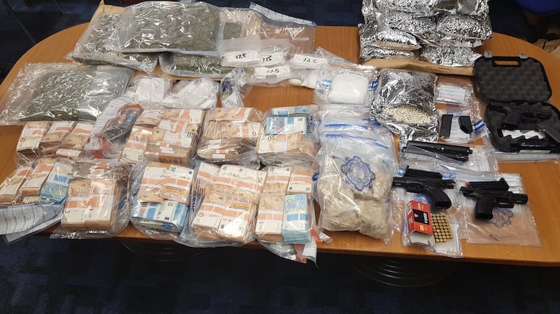 Three firearms and drugs valued at approximately €958,000 were found as well as €489,120 in cash.