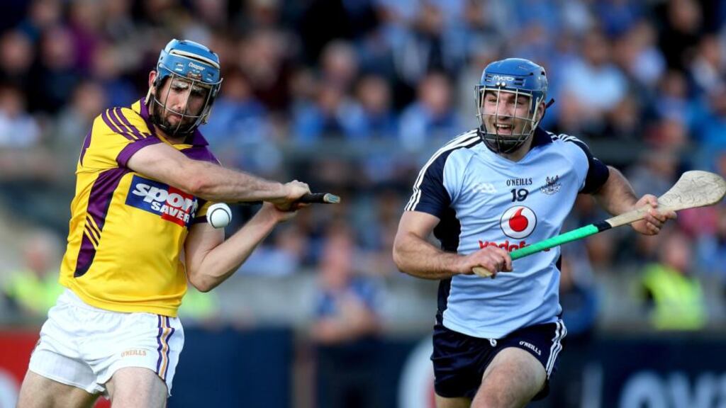 Dubln’s Stephen Hiney and Garrett Sinnott of Wexford at Parnell Park. Photograph: Ryan Byrne/Inpho