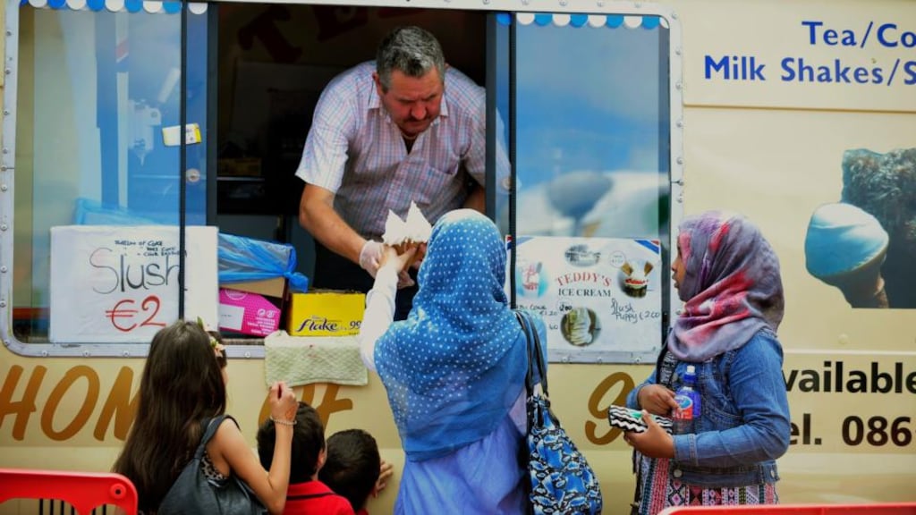 A Muslim woman and children at an ice-cream van at the Islamic Cultural Centre in Clonskeagh, Dublin, during the festival of Eid-al-Fitr. Photograph: Aidan Crawley