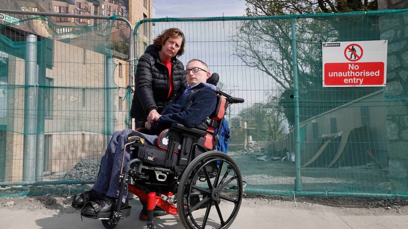 Sheelagh Stubbs and her son Owen:  A developer has built over a public right of way  and put steps between their home and the bus stop. Photograph: Alan Betson