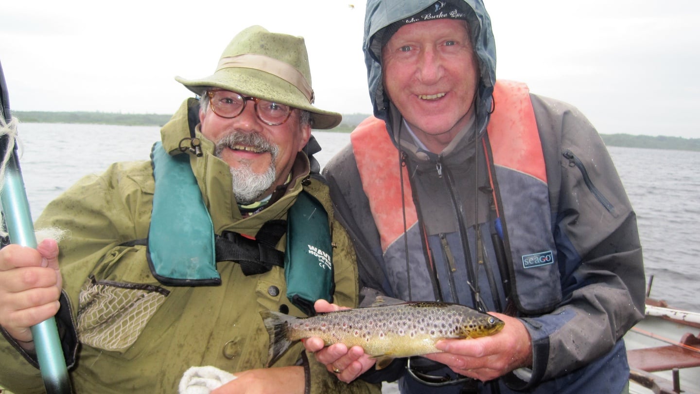 Derek Evans (Irish Times) with trout, and Maurice Neill (County Down Spectator) on Mask during media angling outing.