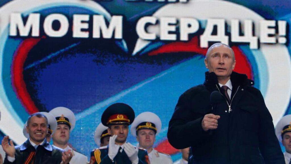 ‘When it comes to double-talk, however, there is no contest. Putin is never going to be a match for Obama at talking out of both sides of his mouth at the same time.’ Above, Vladimir Putin addresses the audience during a rally and a concert called “We are together” to support the annexation of Crimea, on March 18th. The words in the background read, “Crimea is in my heart”. Photograph: Maxim Shemetov/Reuters