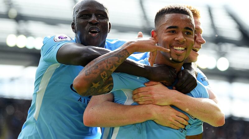 Benjamin Mendy celebrates with goalscorer Gabriel Jesus and Kevin de Bruyne during the Premier League game against Liverpool at the Etihad Stadium. Photograph: Laurence Griffiths/Getty Images