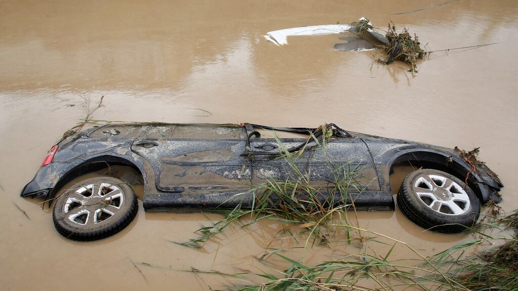 A car is submerged following floods in Livorno, Italy, which claimed the lives of at least six people. Photograph: Leonardo Bianchi/Reuters