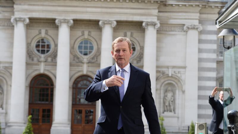 Taoiseach Enda Kenny leaving Government buildings to go to Áras an Uachtaráin to submit his resignation to President Michael D Higgins. Photograph: Cyril Byrne