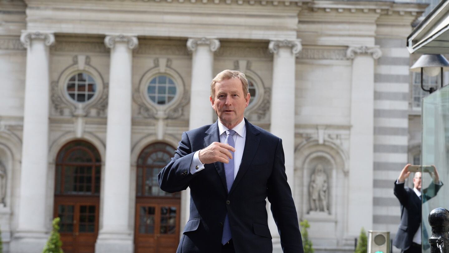 Taoiseach Enda Kenny leaving Government buildings to go to Áras an Uachtaráin to submit his resignation to President Michael D Higgins. Photograph: Cyril Byrne