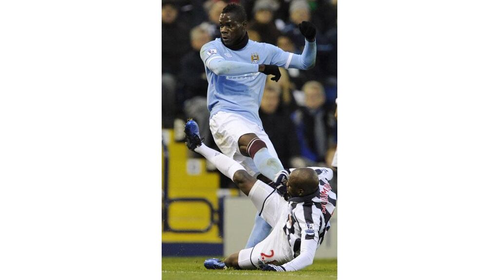 Mario Balotelli gets involved with Youssouf Mulumbu before being sent off at the Hawthorns. Photograph: Nigel Roddis/Reuters