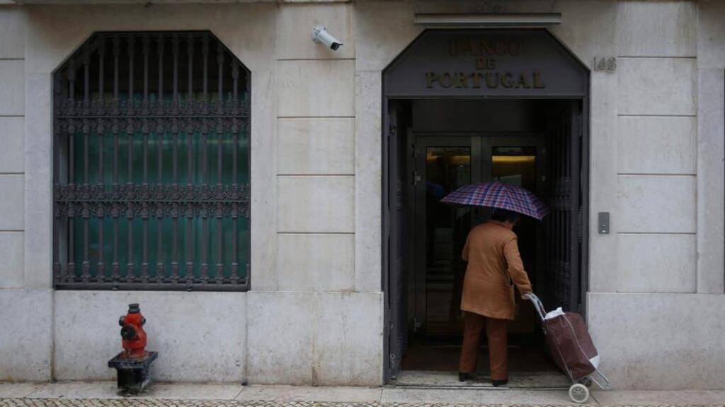 A woman enters the Bank of Portugal in Lisbon. The latest troika review of the Portuguese programme said that the programme was on track. Photograph:Rafael Marchante/Reuters