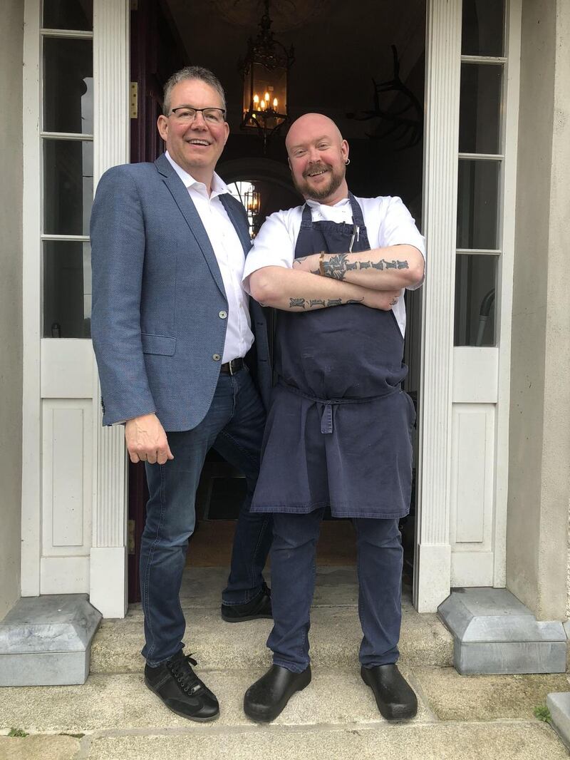 John Comerford (left) and Keith Boyle at the entrance to Creamery House in Castlecomer.