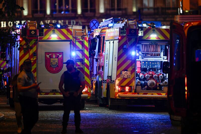 Fire engines at the scene. Photograph: Horacio Villalobos/Getty Images
