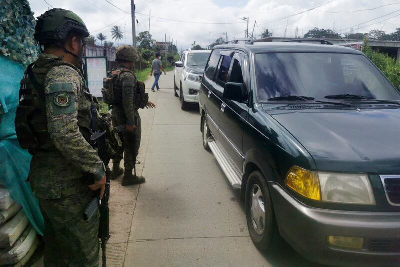 Filipino troopers man a checkpoint near the site where a bomb exploded in Marawi, southern Philippines. Photograph: Froilan Gallardo/AP