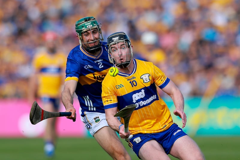 Robert Doyle of Tipperary competes with Tony Kelly. Photograph: Natasha Barton/Inpho