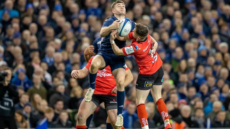 Leinster’s Luke McGrath with Michael Lowry of Ulster challenge for the ball during the Heineken Champions Cup quarter-final at the Aviva stadium. Photograph: Morgan Treacy/Inpho
