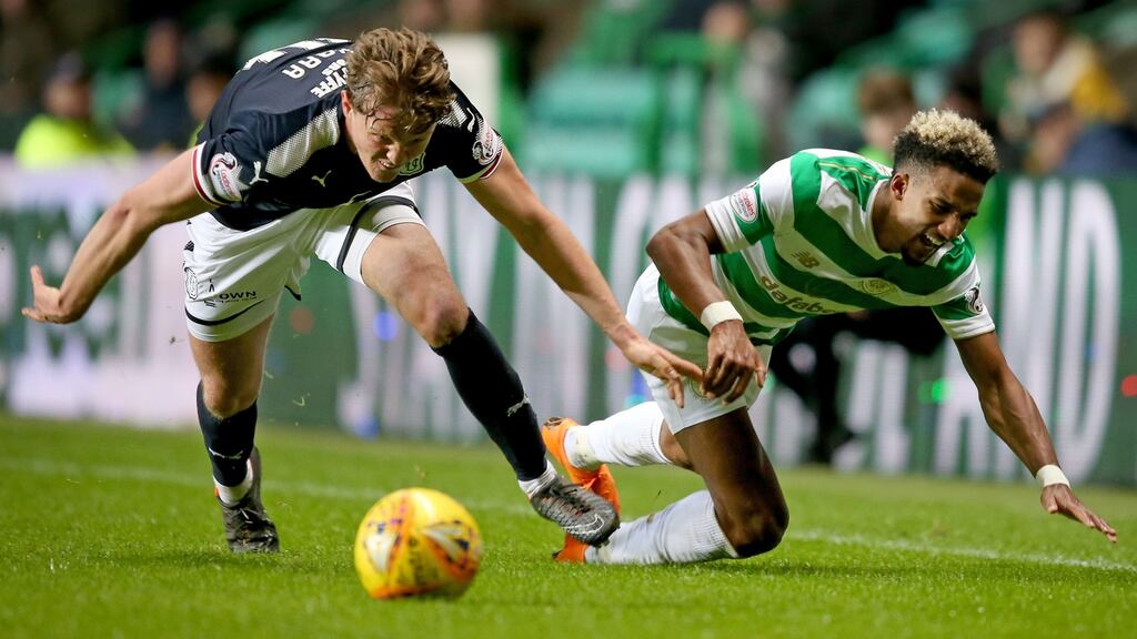 Scott Sinclair is tackled by Dundee’s Mark O’Hara during Celtic’s goalless draw at Parkhead. Photograph: Jane Barlow/PA