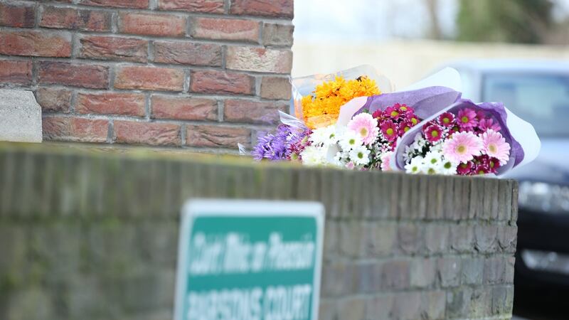 Flowers are seen outside the house at Parson’s Court. Photograph: Collins