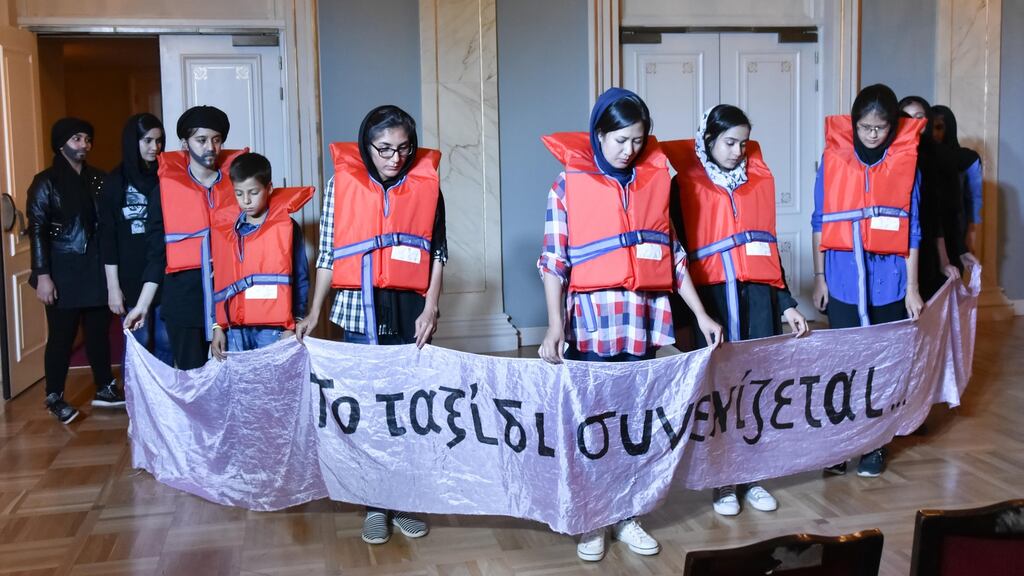 Women and children perform a play in the Schisto refugee camp near Athens describing their journey and experiences. Photograph: ActionAid