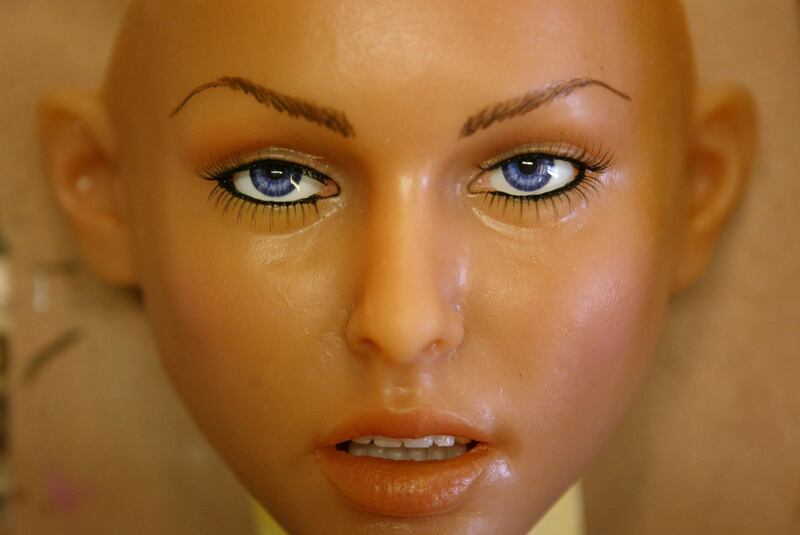 A silicone RealDoll sex doll face looks up from a workbench at the Abyss Creations factory in San Marcos, California. Photograph: David McNew/Getty Images