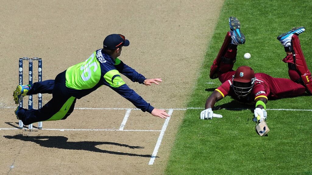 William Porterfield tries to run out Darren Sammy during Ireland’s 2015 Cricket World Cup clash with the West Indies. Photograph: Chris Symes/Inpho