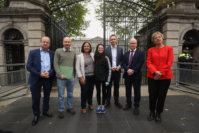 Cara Darmody with Opposition politicians (from left) Michael Collins of Independent Ireland, Paul Murphy of People Before Profit-Solidarity, Sinn Féin leader Mary Lou McDonald, Social Democrats acting leader Cian O'Callaghan, Aontú leader Peadar Tóibín and Labour leader Ivana Bacik. Photograph: Liam McBurney/PA Wire