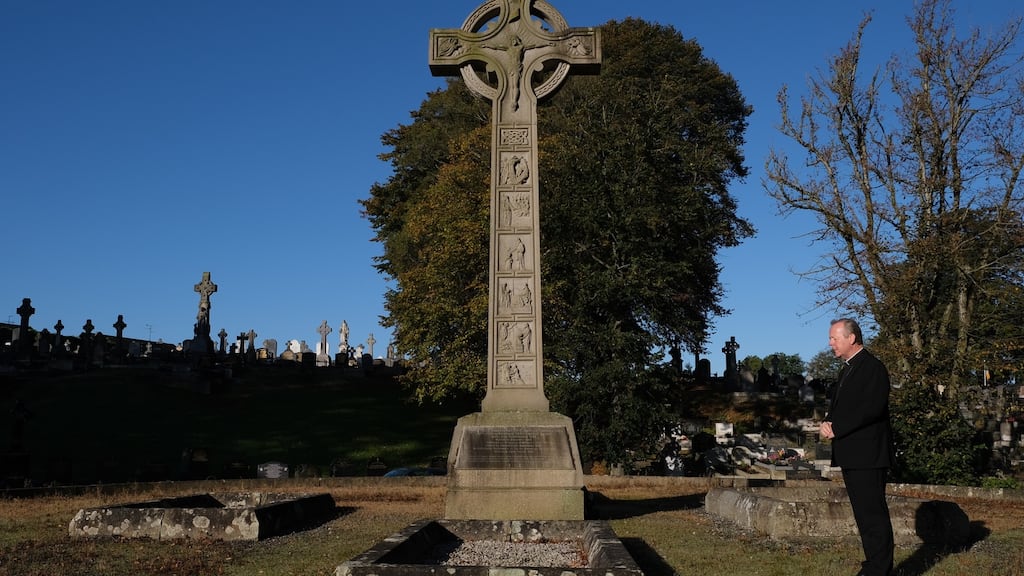 Archbishop Eamon Martin at the graves of his predecessors in Armagh: ‘I found myself sharing with them in prayer the sincere hopes that I, and the other church leaders in Ireland, have for the centenary service.’ Photograph: Janet Forbes
