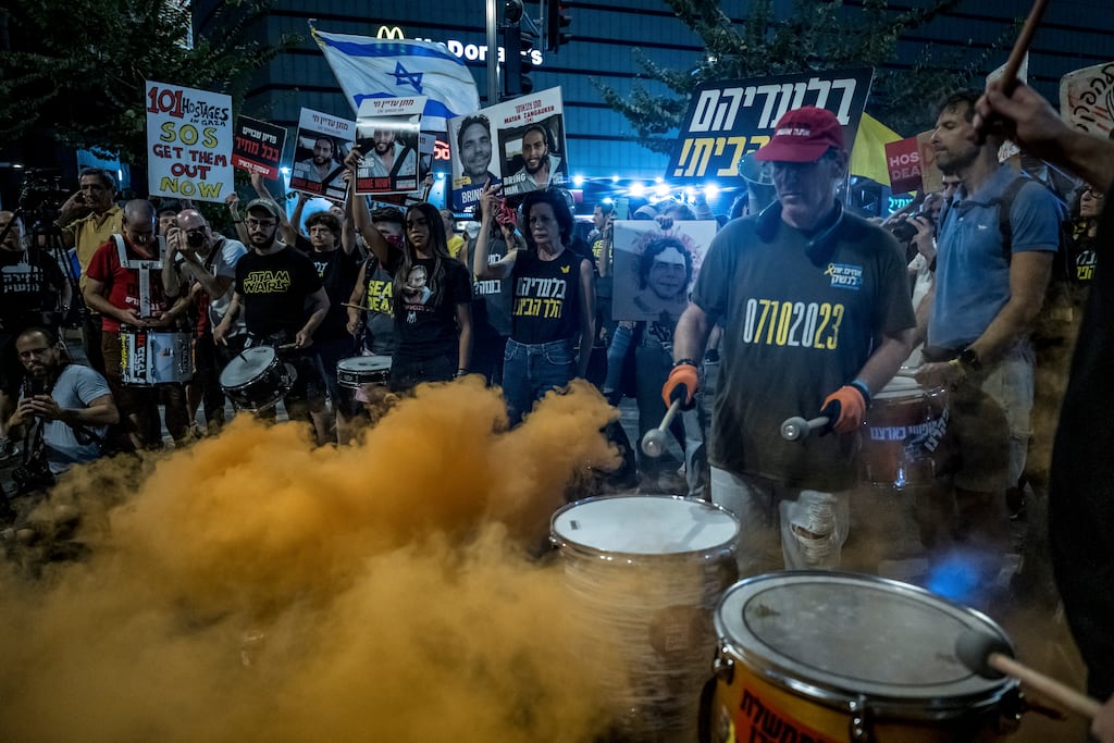 Middle East conflict: Demonstrators supporting the families of Israeli hostages being held by Hamas in Gaza rally in favor of a truce outside of the ministry of defence in Tel Aviv, Israel, on Thursday. Photograph: Sergey Ponomarev/The New York Times
