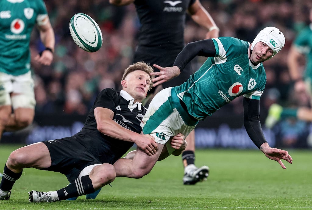 Mack Hansen is tackled by Jordie Barrett during the defeat to New Zealand at the Aviva Stadium. Photograph: Dan Sheridan/Inpho