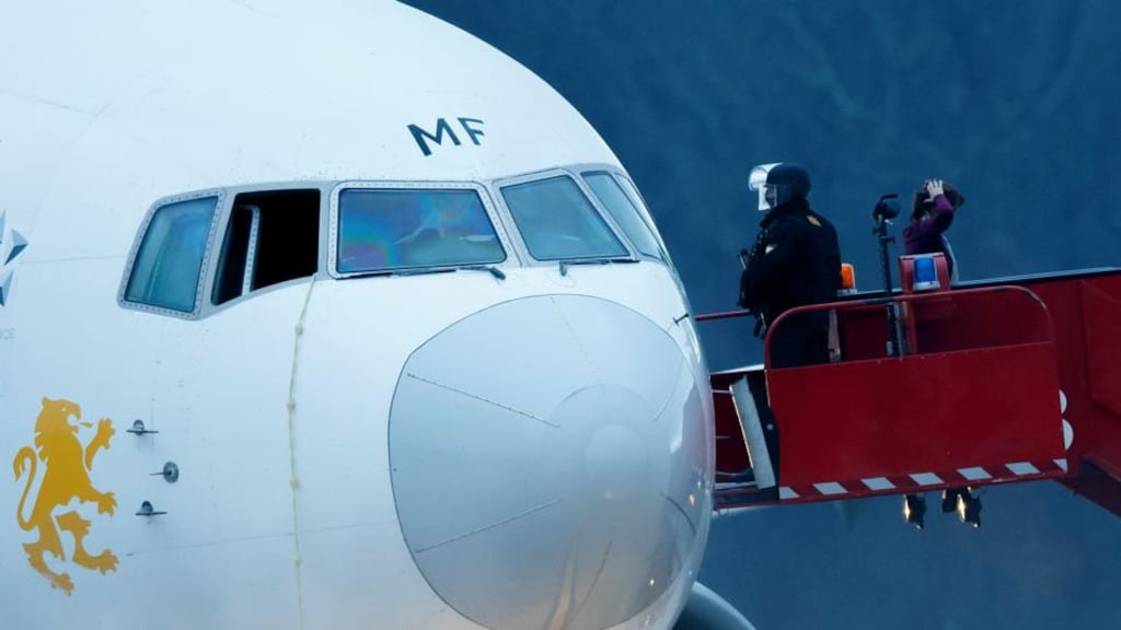 Police evacuate passengers from a hijacked Ethiopian Airlines plane in Geneva, Switzerland. Photograph: AP Photo