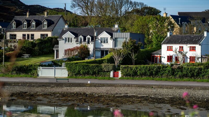 The property is set at the water’s edge across a small road