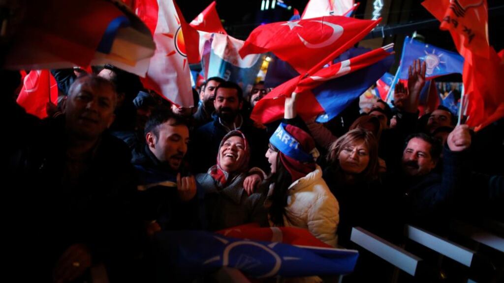 Supporters of the ruling AK Party wave Turkish and party flags as they wait for the arrival of Turkish prime minister Tayyip Erdogan at the party’s headquarters in Ankara yesterday. Photograph: Reuters/Umit Bektas