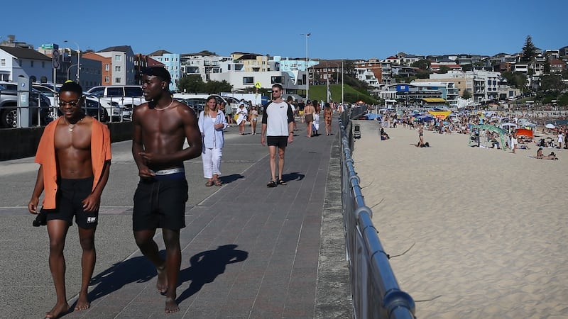 Beachgoers enjoy warm weather on Australia Day at Bondi Beach, Sydney, on January 26th. Foreign tourists will be welcomed back next week for the first time since the pandemic began. Photograph: Lisa Maree Williams/Getty Images