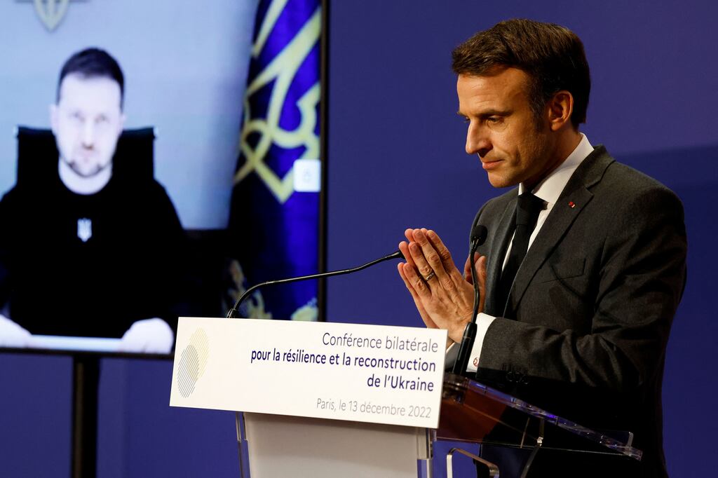 Ukrainian president Volodymyr Zelenskiy is in remote attendance as French president Emmanuel Macron speaks at an international conference convened to co-ordinate infrastructure and humanitarian aid to Ukraine. Photograph: Lodovic Marin/Getty Images