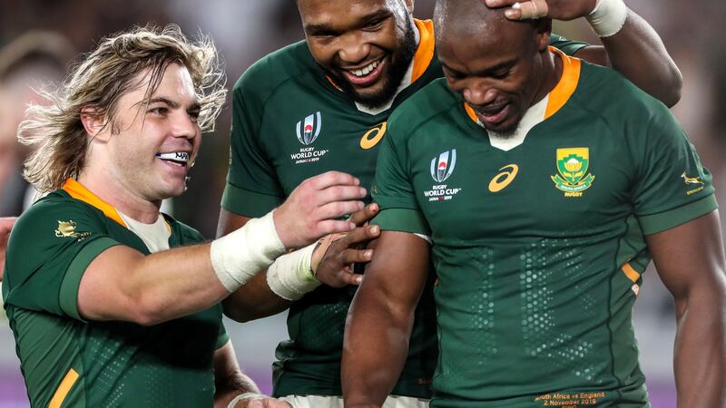 Faf de Klerk and Lukhanyo Am celebrate with Makazole Mapimpi after his try in the World Cup final against England. Photograph: Inpho