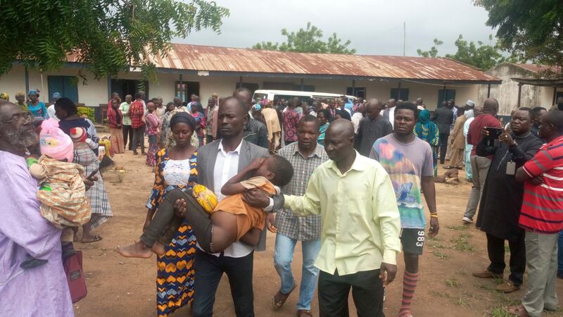 Some of the children and parents reunited in Damishi, Nigeria. Photograph: AP Photo