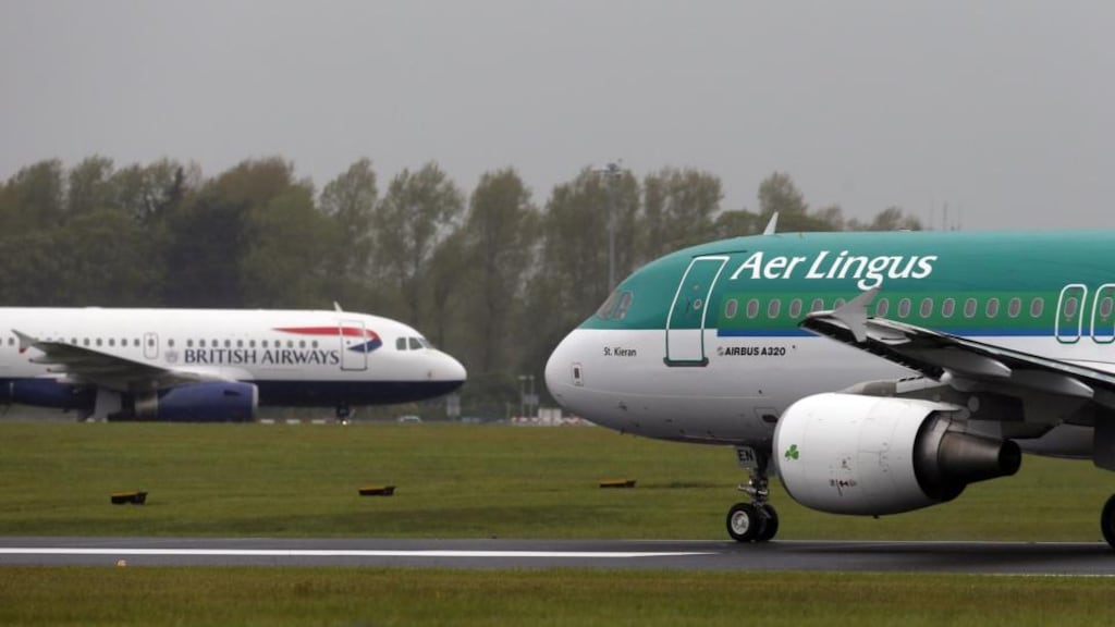 British Airways and Aer Lingus jets pass each other at Dublin airport. Photograph: Niall Carson/PA Wire