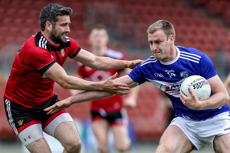 Down's Kevin McKernan with Dónal Kingston of Laois. Photograph: Laszlo Geczo/Inpho