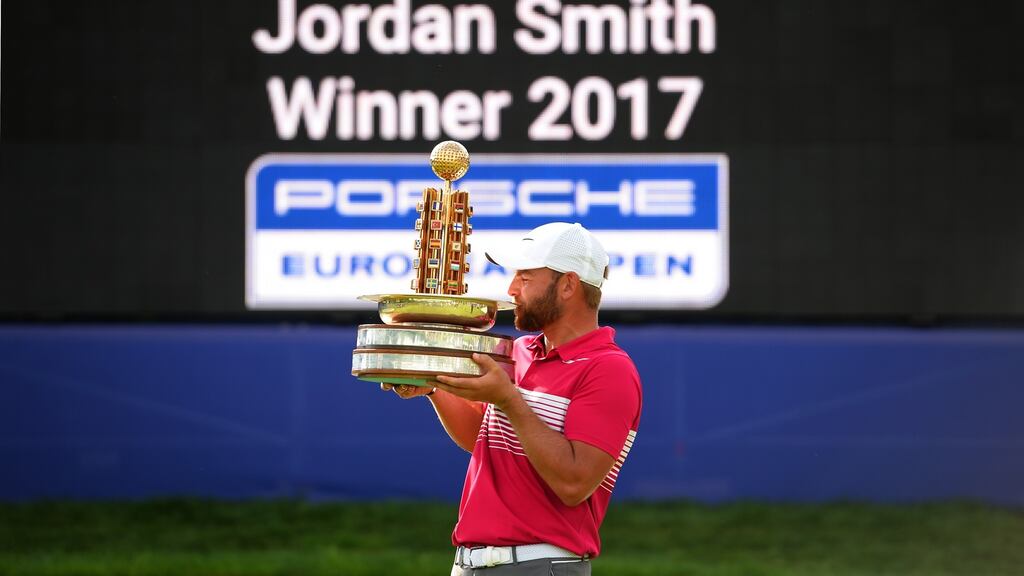 Jordan Smith of England poses with the trophy after winning the Porsche European Open at Green Eagle Golf Course in Hamburg, Germany. Photo: Tony Marshall/Getty Images