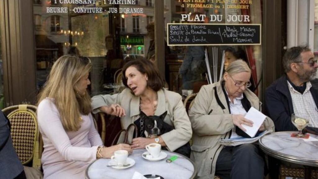 Relaxing in a French cafe, untroubled by work emails.