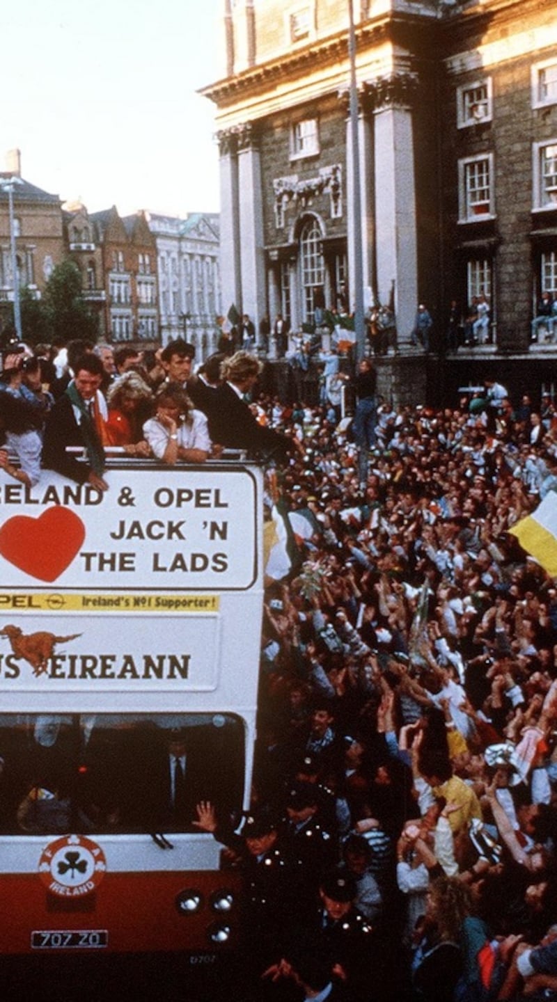 The Irish team in an open-top bus are welcomed by the crowds in Dublin on their return from the 1990 World Cup in Italy. Photograph: Inpho
