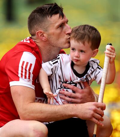 Cork’s Patrick Horgan with his son Jack after the game. Photograph: James Crombie/Inpho