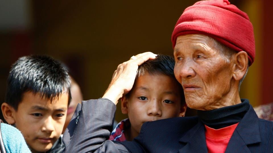 Father and sons of Nepalese mountaineer Ang Kaji Sherpa, killed in an avalanche on Mount Everest, wait for his body to arrive at Sherpa Monastery in Katmandu, Nepal. Photograph: AP Photo/Niranjan Shrestha