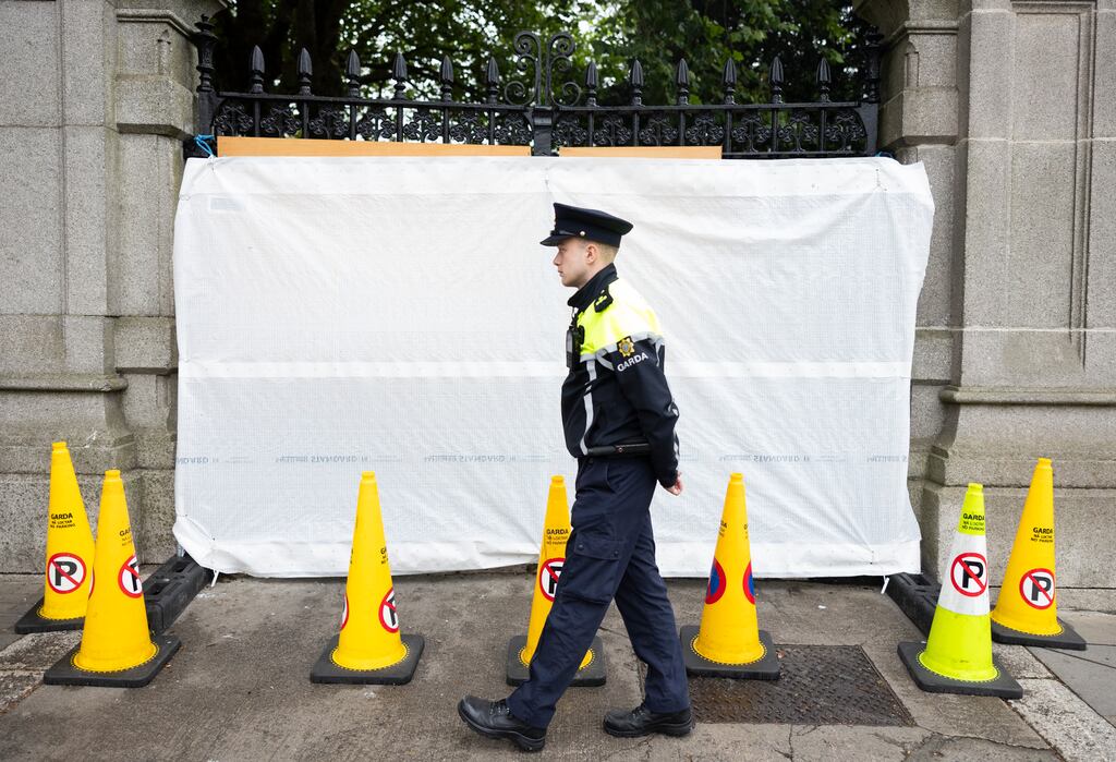 A garda on patrol at the rear of Leinster House after entrance gates were rammed by a car last August. Photograph: Sam Boal/Collins