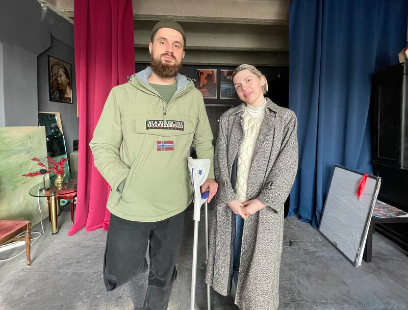 Ukrainian soldier Stanislav Dekhtiar and photographer Marta Syrko in her studio in Lviv. Photograph: Daniel McLaughlin