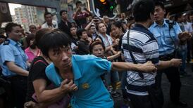 Scuffles break out in  Hong Kong as protester numbers fall