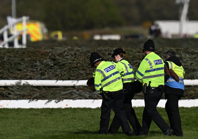 An animal rights protester is taken away by police ahead of the Grand National at Aintree in Liverpool. Photograph: Paul Ellis/AFP/via Getty Images