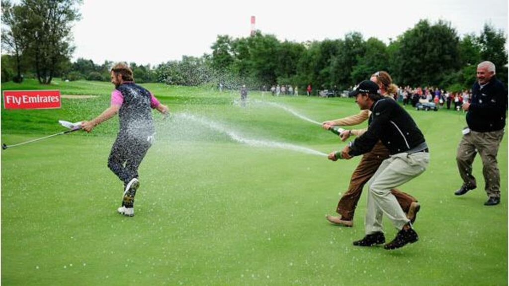 Pablo Larrazabal and Miguel Angel Jimenez lead the celebrations after Jose Manuel Lara clinched victory at the Austrian Open. Photograph: Stuart Franklin/Getty Images